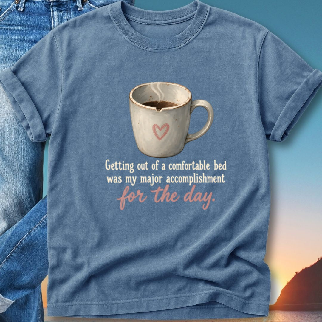 Blue t-shirt with mug of coffee and text "Getting out of a comfortable bed was my major accomplishment for the day."