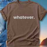 Brown t-shirt with "whatever." in white text, laid over jeans.