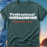 Dark green t-shirt with "Professional Overachiever" and "I delegate like a boss!" text.
