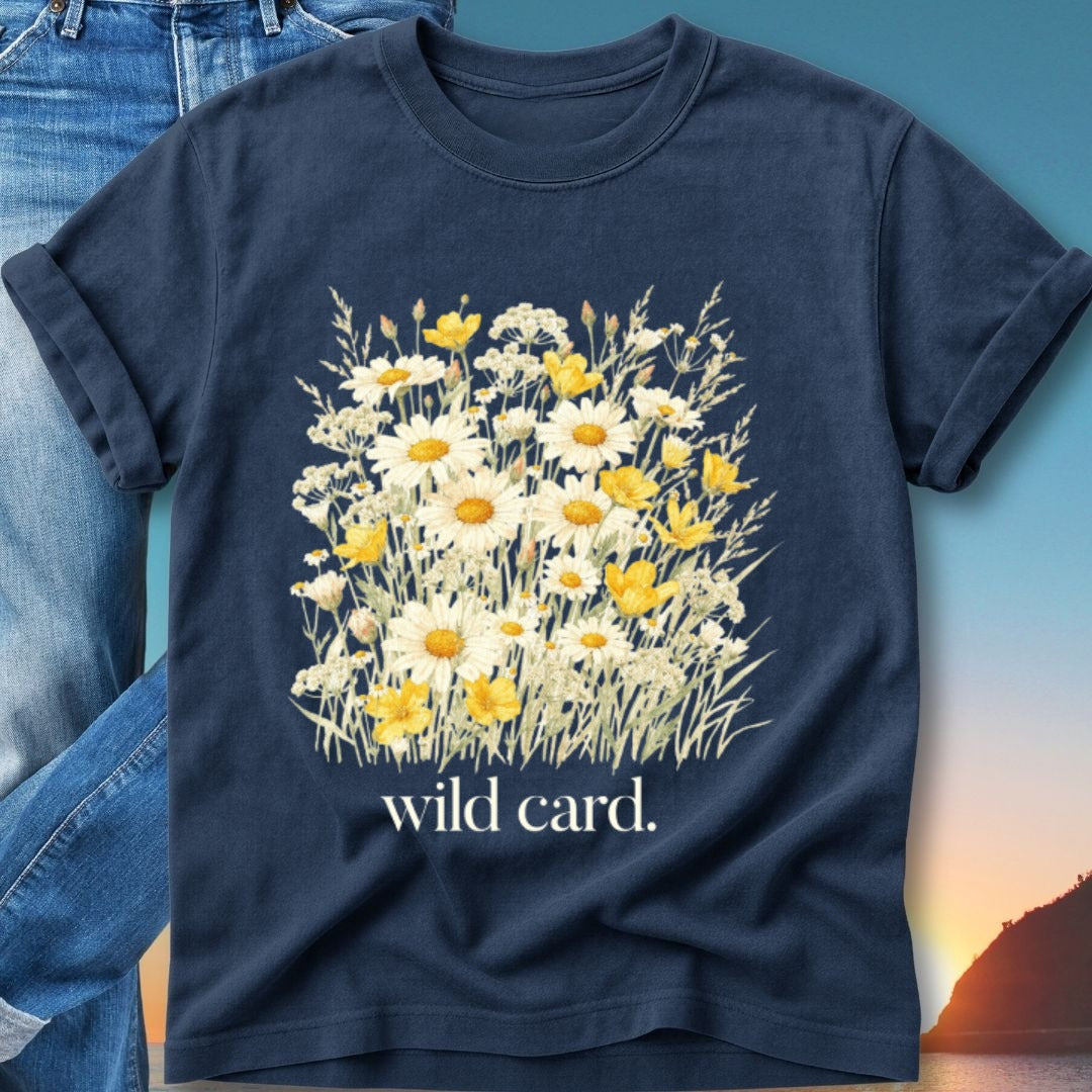 Navy t-shirt with a watercolor bouquet of white and yellow wildflowers and "wild card." text.