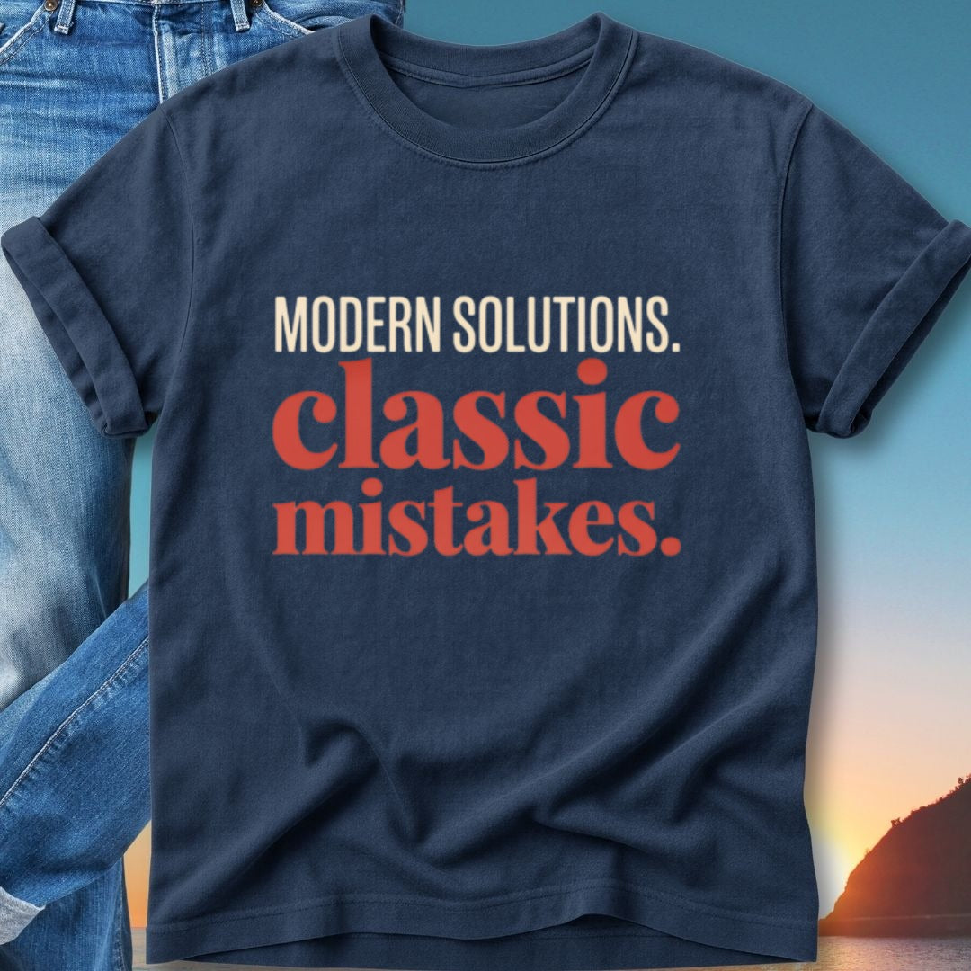 Navy t-shirt with "MODERN SOLUTIONS. classic mistakes." text.