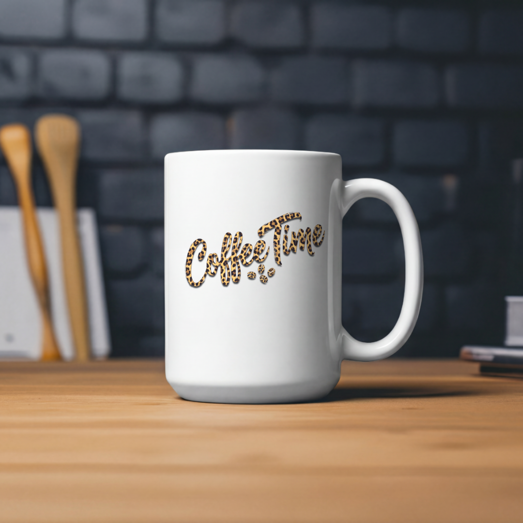 White mug with "Coffee Time" in leopard print text on a wooden table.