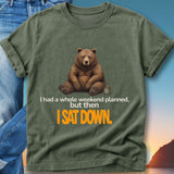 Green t-shirt with bear illustration and text "I had a whole weekend planned, but then I SAT DOWN."