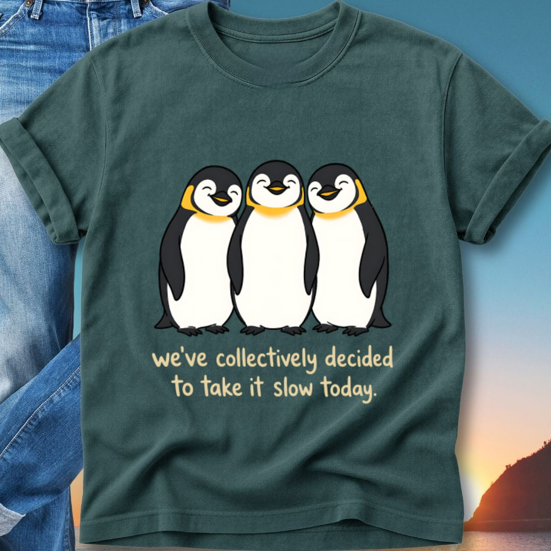 T-shirt with three smiling penguins and text "we've collectively decided to take it slow today."
