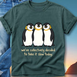 T-shirt with three smiling penguins and text "we've collectively decided to take it slow today."