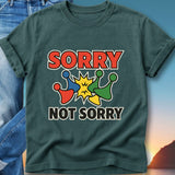 Dark green t-shirt with "SORRY NOT SORRY" and colorful game pieces.