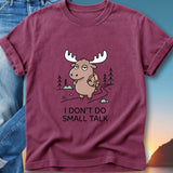 Maroon t-shirt with a cartoon moose wearing a backpack, hiking and saying "I don't do small talk".