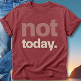Red t-shirt with "not today." text, worn with jeans, sunset background.