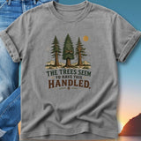 Gray t-shirt with trees and mountains graphic, "The Trees Seem To Have This Handled" text.
