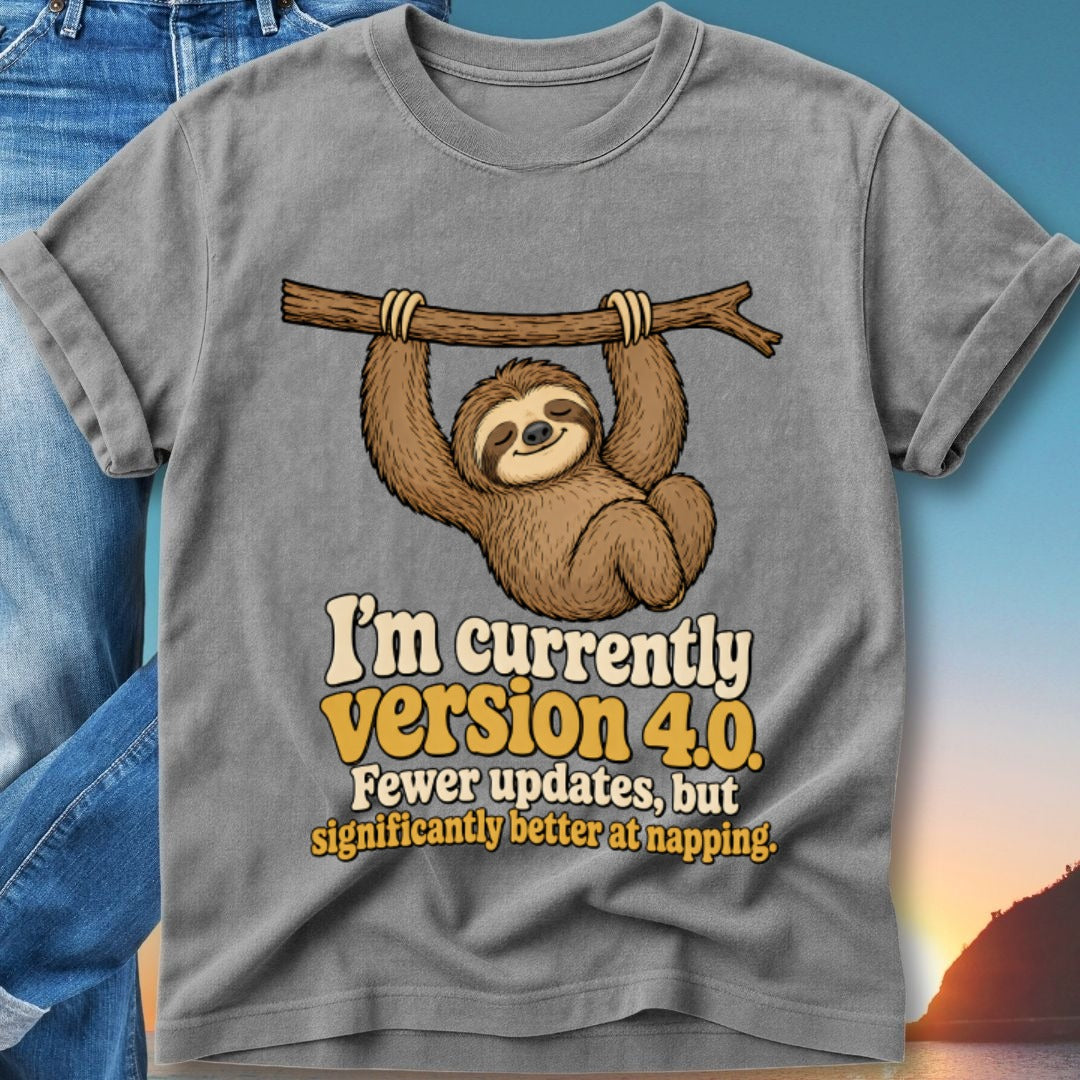 Sloth hanging from branch, "I'm currently Version 4.0" text on gray t-shirt.
