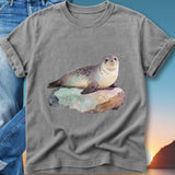 Gray t-shirt with watercolor painting of a seal resting on a rock.