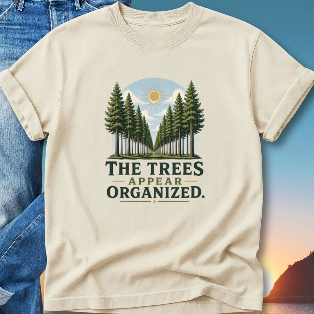T-shirt with "THE TREES APPEAR ORGANIZED." text and a forest scene.