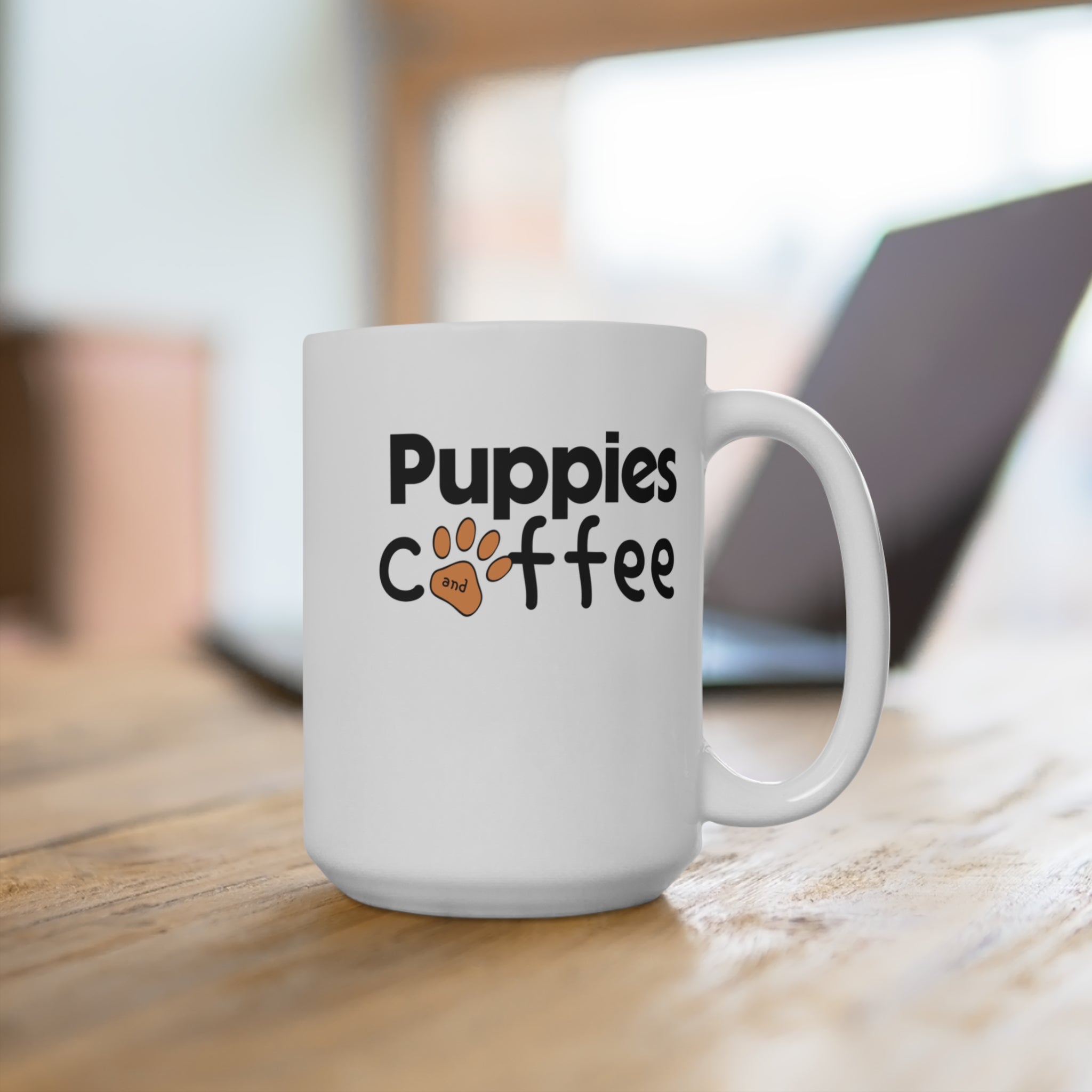 White mug with "Puppies and coffee" text and paw print.