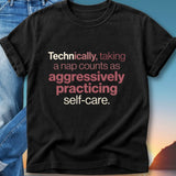 Black t-shirt with text "Technically, taking a nap counts as aggressively practicing self-care."