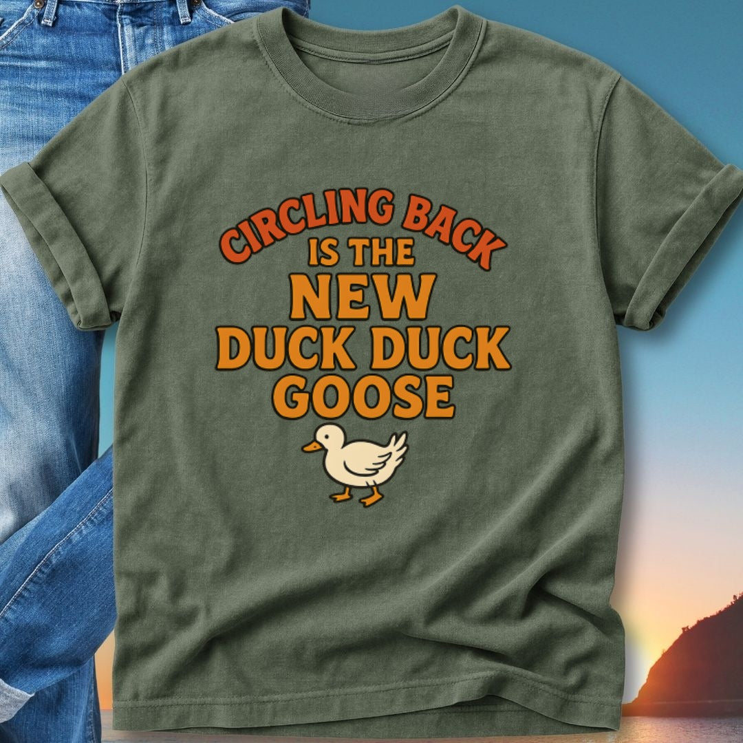 Green t-shirt with "Circling Back is the new Duck Duck Goose" text and a goose graphic.