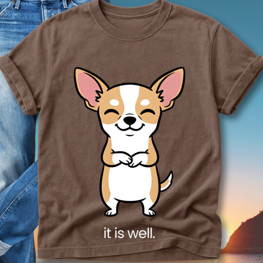 Brown t-shirt with a smiling chihuahua wearing a blue bandana, text reads "it is well."