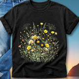 Black t-shirt with a watercolor floral print of yellow and white wildflowers.