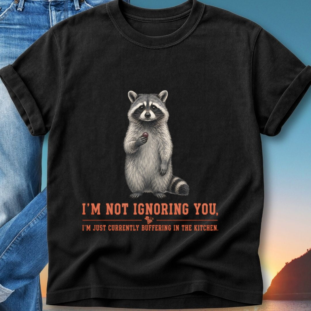 Raccoon wearing a bandana holding a berry, text reads "I'm not ignoring you, I'm just currently buffering in the kitchen."