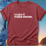 Red t-shirt with "make it make sense." text, cuffed sleeves, and a sunset background.