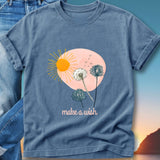 Blue t-shirt with dandelions and sun graphic that reads "make a wish".