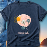 Navy t-shirt with a sun, dandelions, and "make a wish" text.