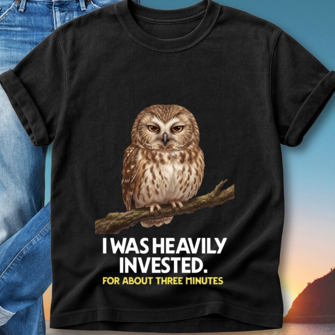 Black t-shirt featuring a wise owl illustration and "I WAS HEAVILY INVESTED" text.