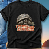 Black t-shirt with tortoise and text: "If you need me, don't. I'm off duty and seeking asylum in the guest bedroom."