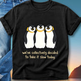 Three happy penguins with "we've collectively decided to take it slow today" text.