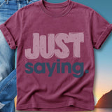 Maroon t-shirt with "JUST saying." text in pink and purple.