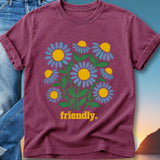 Maroon t-shirt with yellow and blue daisies and "friendly." text.