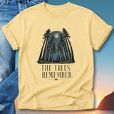 Yellow t-shirt with forest, moon, and "The Trees Remember" text.