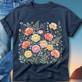 Navy t-shirt with a watercolor floral print of poppies, roses, and ferns.