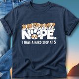 Navy t-shirt with cartoon puppies and text "NOPE. I HAVE A HARD STOP AT 5".