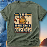 Green t-shirt with "The Sun Doesn't Wait For A Consensus" and sun graphic.