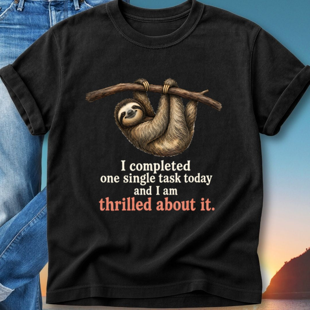 Black t-shirt with sloth hanging from branch, text "I completed one single task today and I am thrilled about it."