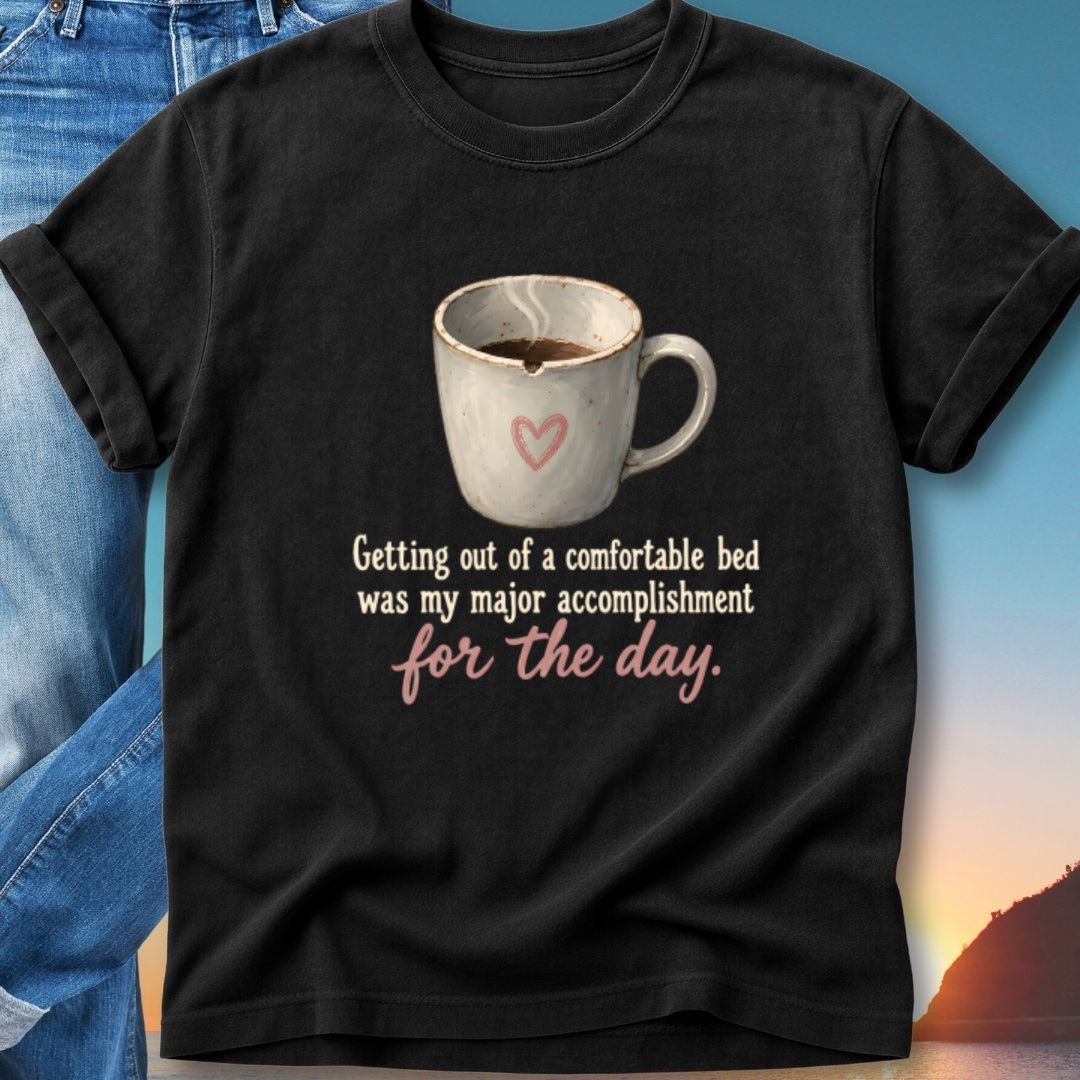 Black t-shirt with mug of coffee and text about a comfortable bed.