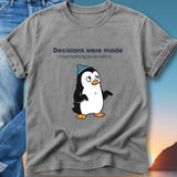 T-shirt with penguin wearing a blue hat, reading "Decisions were made I had nothing to do with".
