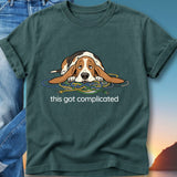 Basset hound tangled in colorful wires on a t-shirt with "this got complicated".