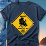 Yellow diamond sign with a bear sitting in a chair and using a phone.