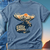 T-shirt graphic of a moose head with mountains, trees, and a sunset behind it.