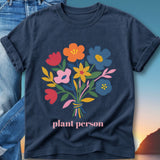Navy t-shirt with colorful floral bouquet and "plant person" text.