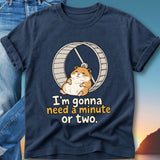 Navy t-shirt with a cartoon hamster on a wheel and text that says "I'm gonna need a minute or two."