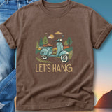 Brown t-shirt with a light blue scooter and trees graphic, text "LET'S HANG".