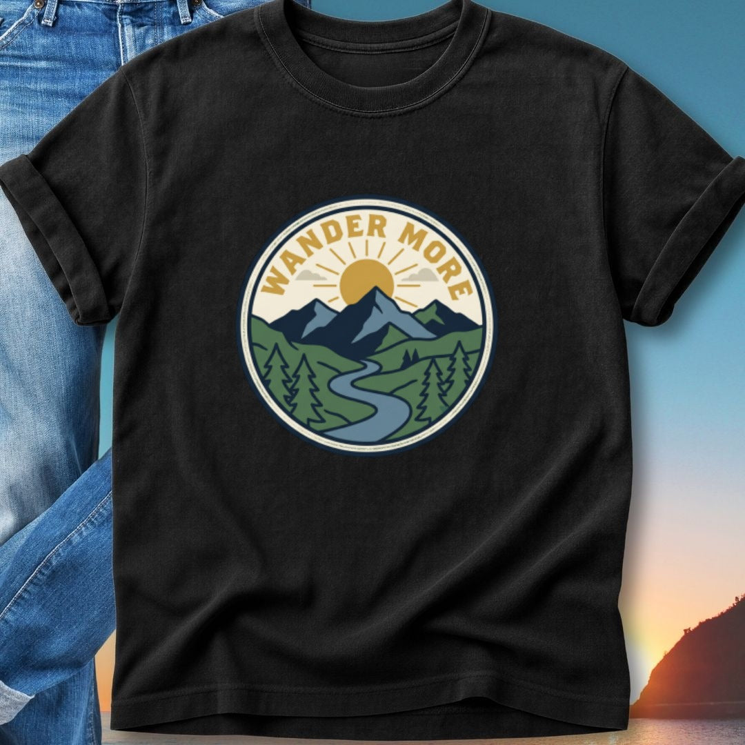 Black t-shirt with circular "Wander More" mountain landscape logo.