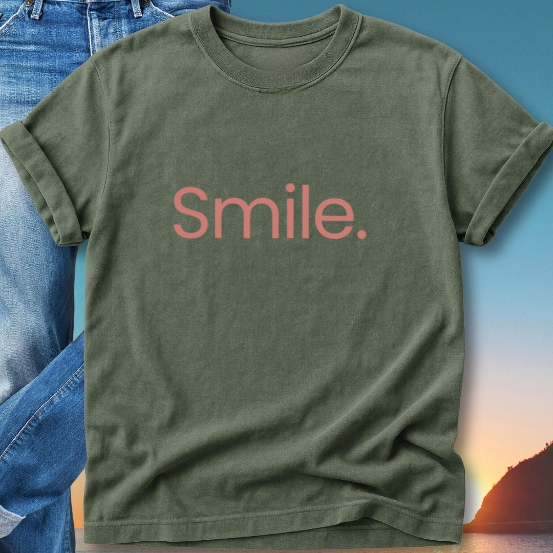 Olive green t-shirt with "Smile." text in pink lettering.