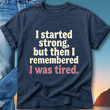 Navy t-shirt with "I started strong, but then I remembered I was tired." text.