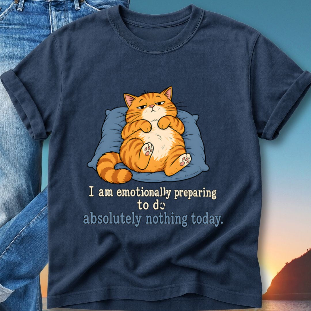 Dark blue t-shirt with a cartoon cat on a pillow and text.