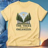 Yellow t-shirt with "The trees appear organized." text and a forest landscape graphic.