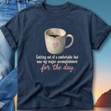 Navy t-shirt with "Getting out of a comfortable bed was my major accomplishment for the day." text.