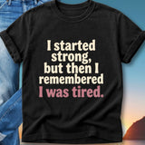 Black t-shirt with "I started strong, but then I remembered I was tired." text.